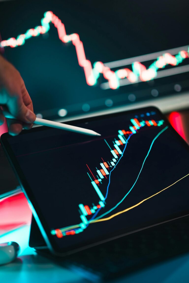 Close-up of a digital stock market graph on a tablet screen, symbolizing climate-conscious investing and sustainable finance